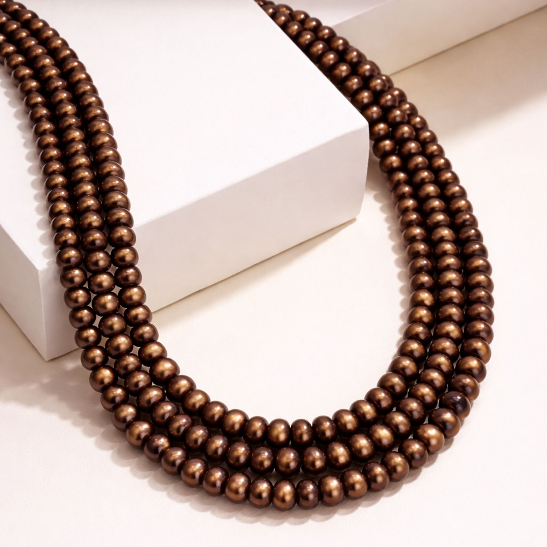 Antique Glow Triple Strand Pearl Necklace