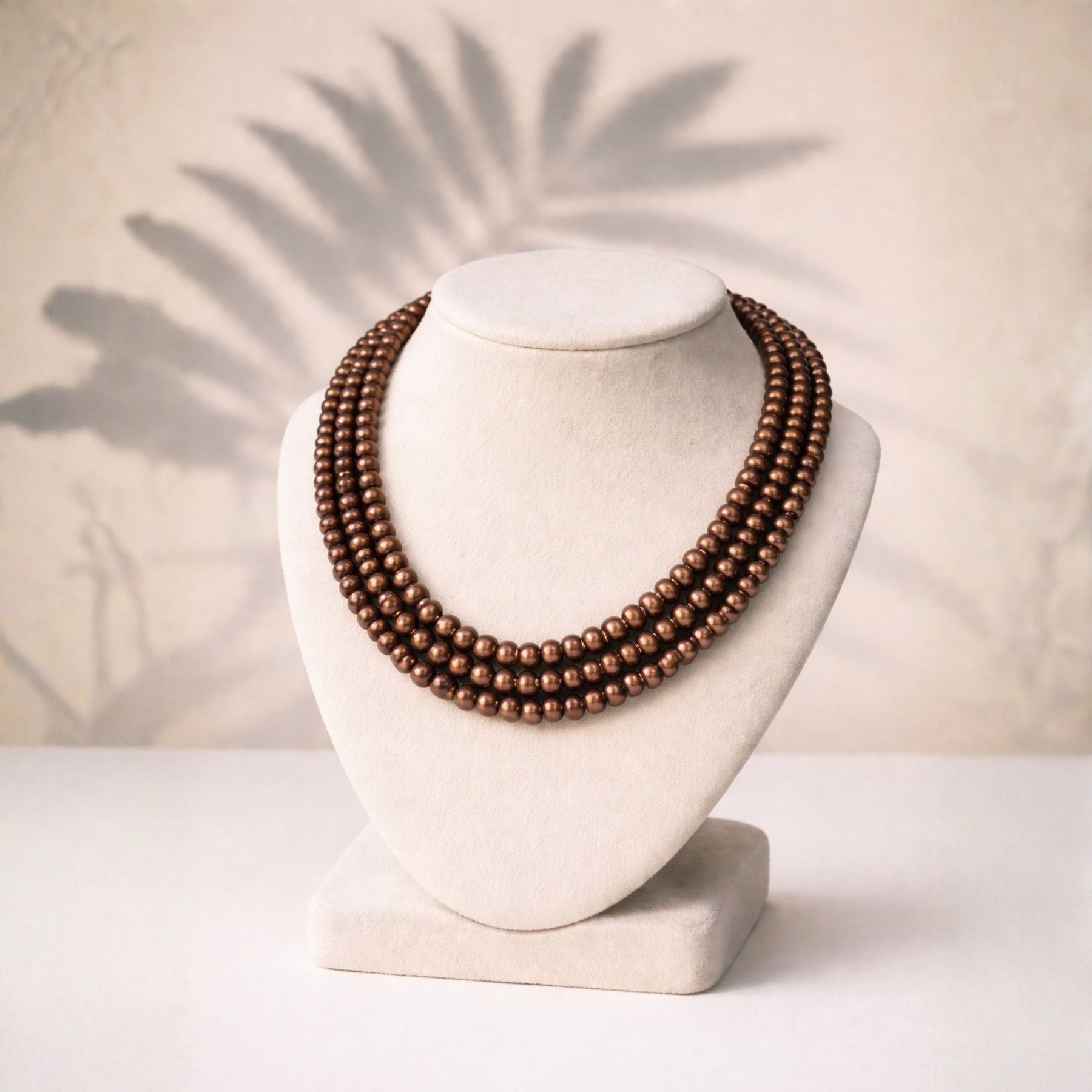 Antique Glow Triple Strand Pearl Necklace