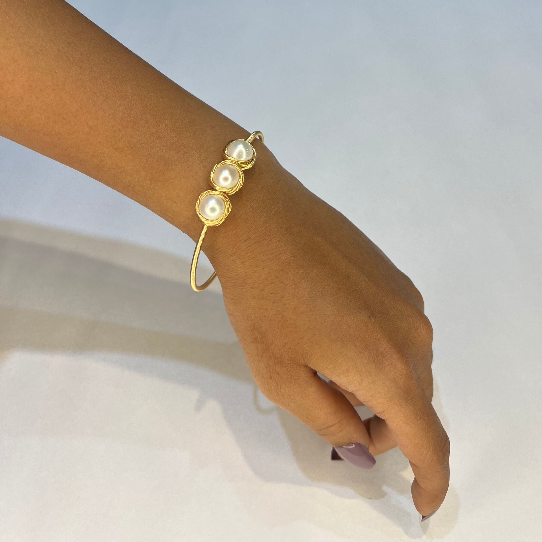 Golden Nest – Trio Pearl Rakhi Bracelet