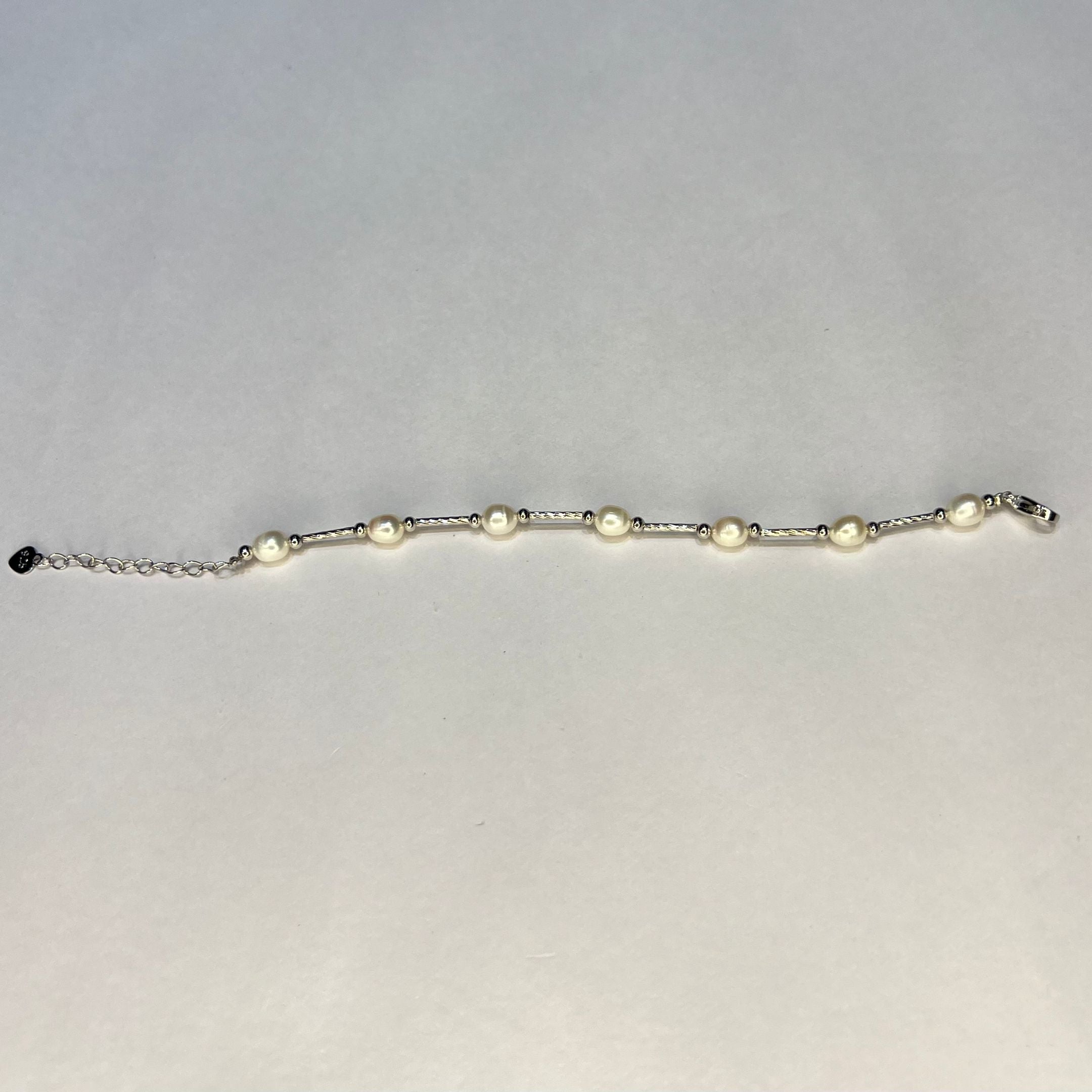 Threaded Gleam Pearl Rakhi Bracelet