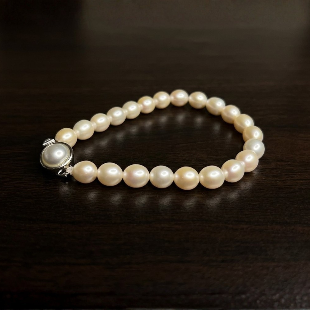 Single Row Cream Oval Pearl Bracelet (7.20mm)