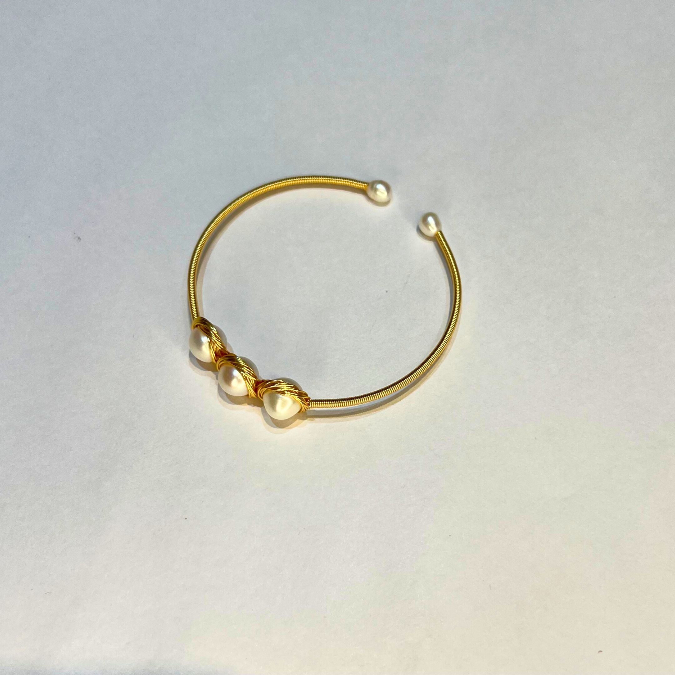 Golden Nest – Trio Pearl Rakhi Bracelet